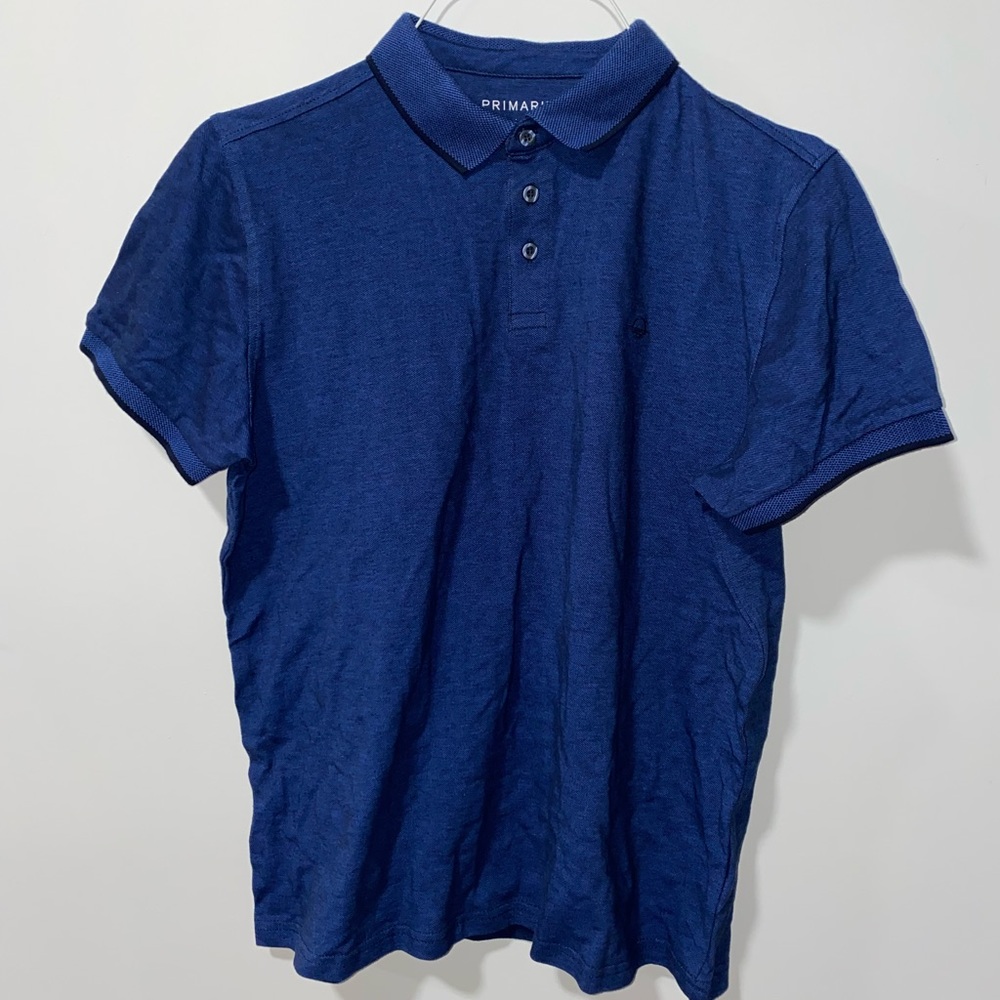 Clean dark blue Polo tee.